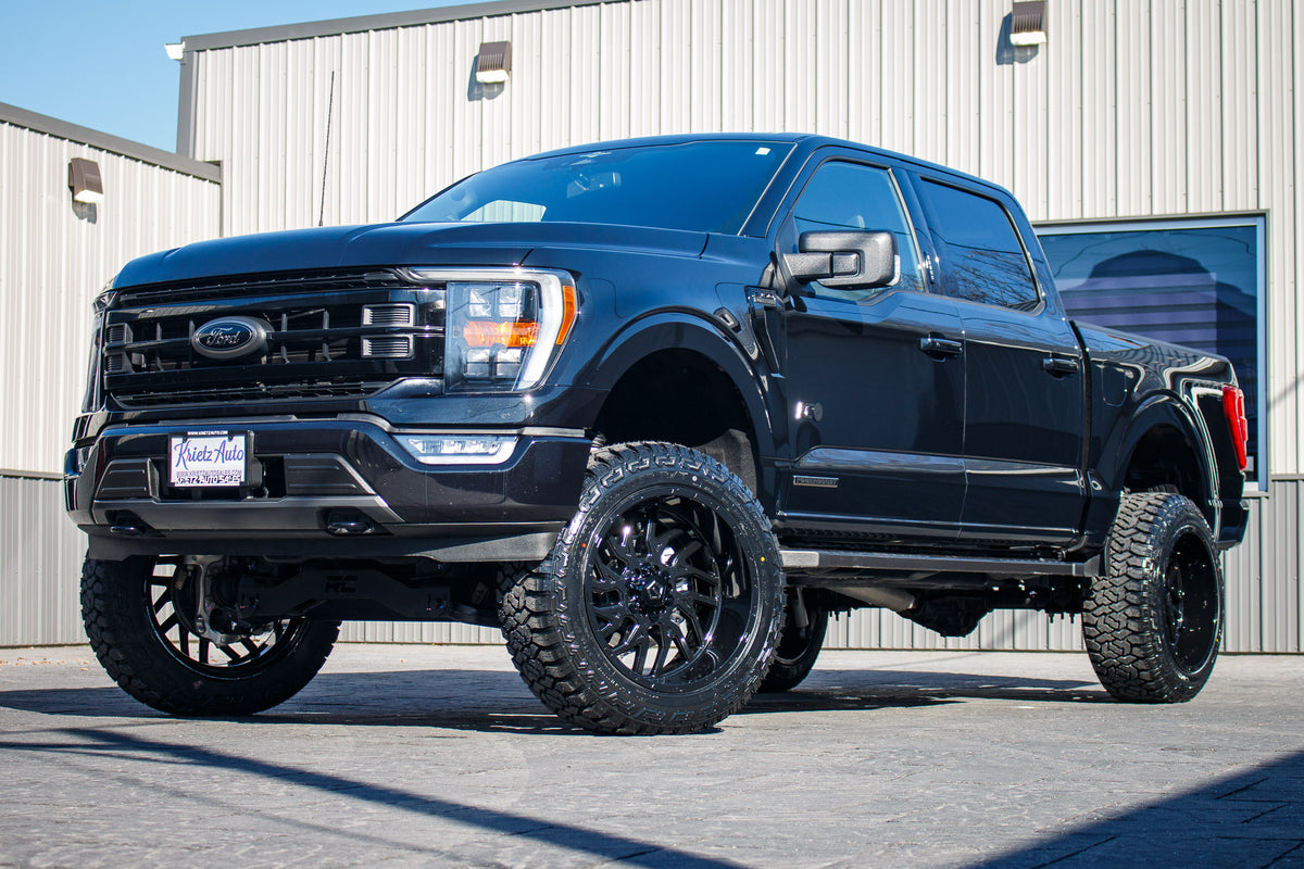2023 Ford F-150 XLT with a 6" Rough Country Hunter R/T tires, 22x12 TIS 554B wheels, and 35" Fury Country Hunter R/T tires.