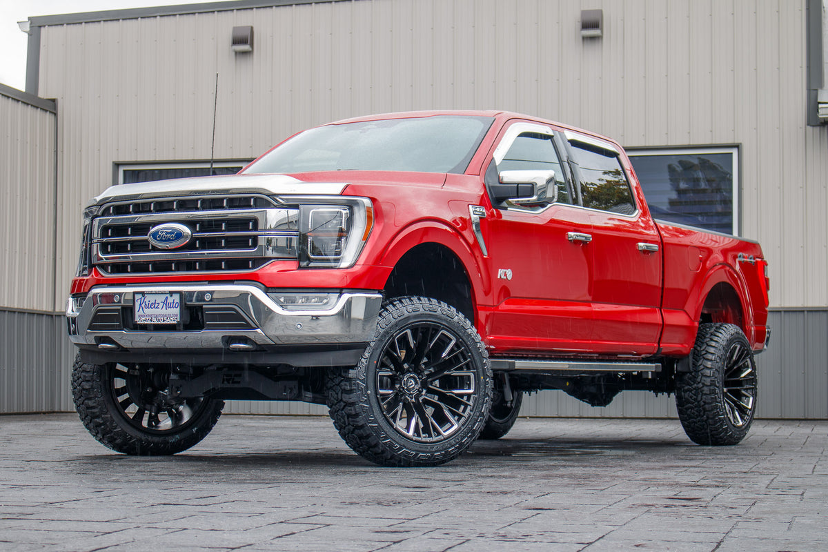 2023 Ford F-150 Lariat with a 6" Rough Country lift kit, 22x12 Fuel Rebar wheels, and 35" Fury Country Hunter R/T tires.