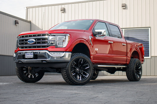 2023 Ford F-150 Lariat with a 6" Rough Country lift kit, 22x12 Fuel Rebar wheels, and 35" Fury Country Hunter R/T tires.