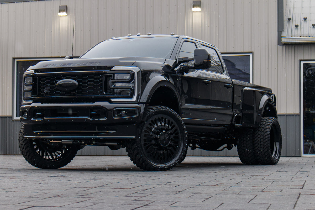 2024 Ford F-450 Super Duty Platinum with a 4" Wicked lift kit, 26x8.25 American Force Brawn wheels, and 37" AMP Terrain Attack M/T A tires.