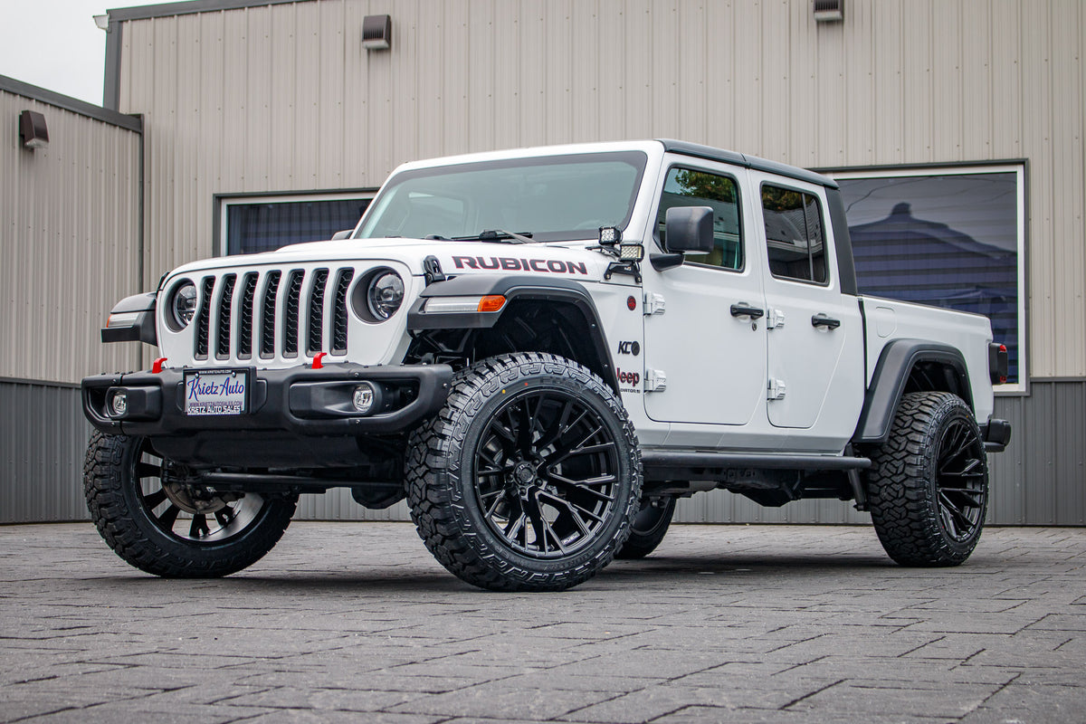 2023 Jeep Gladiator Rubicon with a 2.5" Rough Country lift kit, 22x12 Fuel Rebar wheels, and 35" Fury Country Hunter R/T tires.