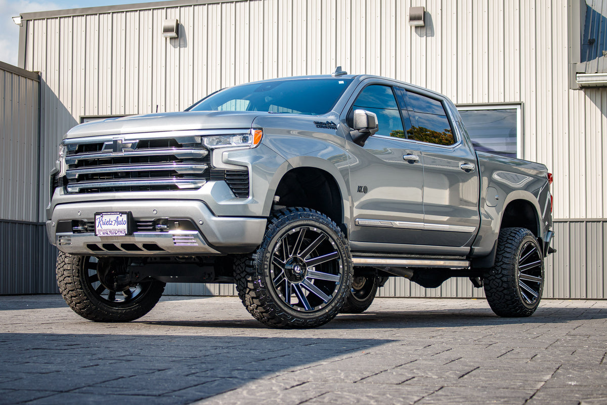 2023 Chevrolet Silverado 1500 with a 6" Rough Country suspension kit, 22x12 Fuel Contra wheels, and 35" Fury Country Hunter R/T tires.