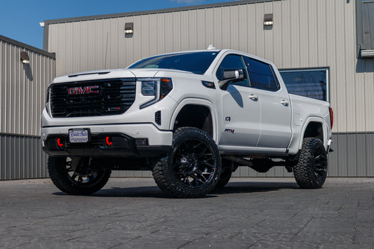 2024 GMC Sierra 1500 AT4 with a 6" Rough Country lift kit, 22x12 Fuel Twitch wheels, and 35" Fury Country Hunter R/T tires.