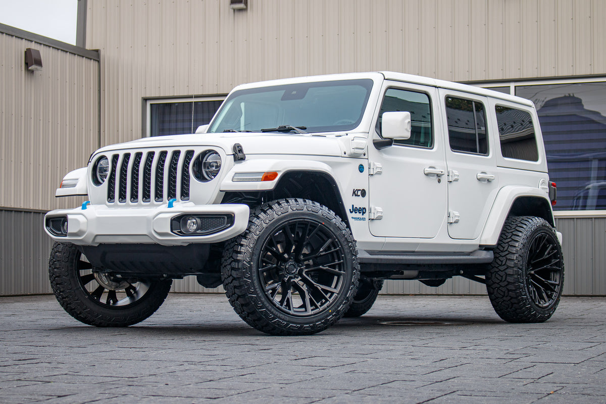 2022 Jeep Wrangler Unlimited Sahara 4XE with a 2.5" Rough Country lift kit, 22x12 Fuel Rebar wheels, and 35" Fury Country Hunter R/T tires.