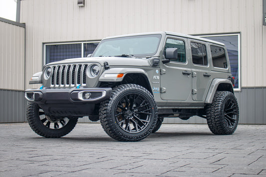 2023 Jeep Wrangler Sahara 4XE with a 2.5" Rough Country lift kit, 22x12 Fuel Rebar wheels, and 35" Avix Trailtek R/T tires.