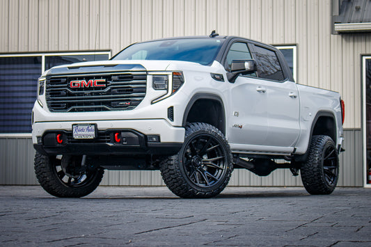 2024 GMC Sierra 1500 AT4 with a 6" Rough Country lift kit, 22x12 Fuel Catalyst wheels, and 35" Fury Country Hunter R/T tires.