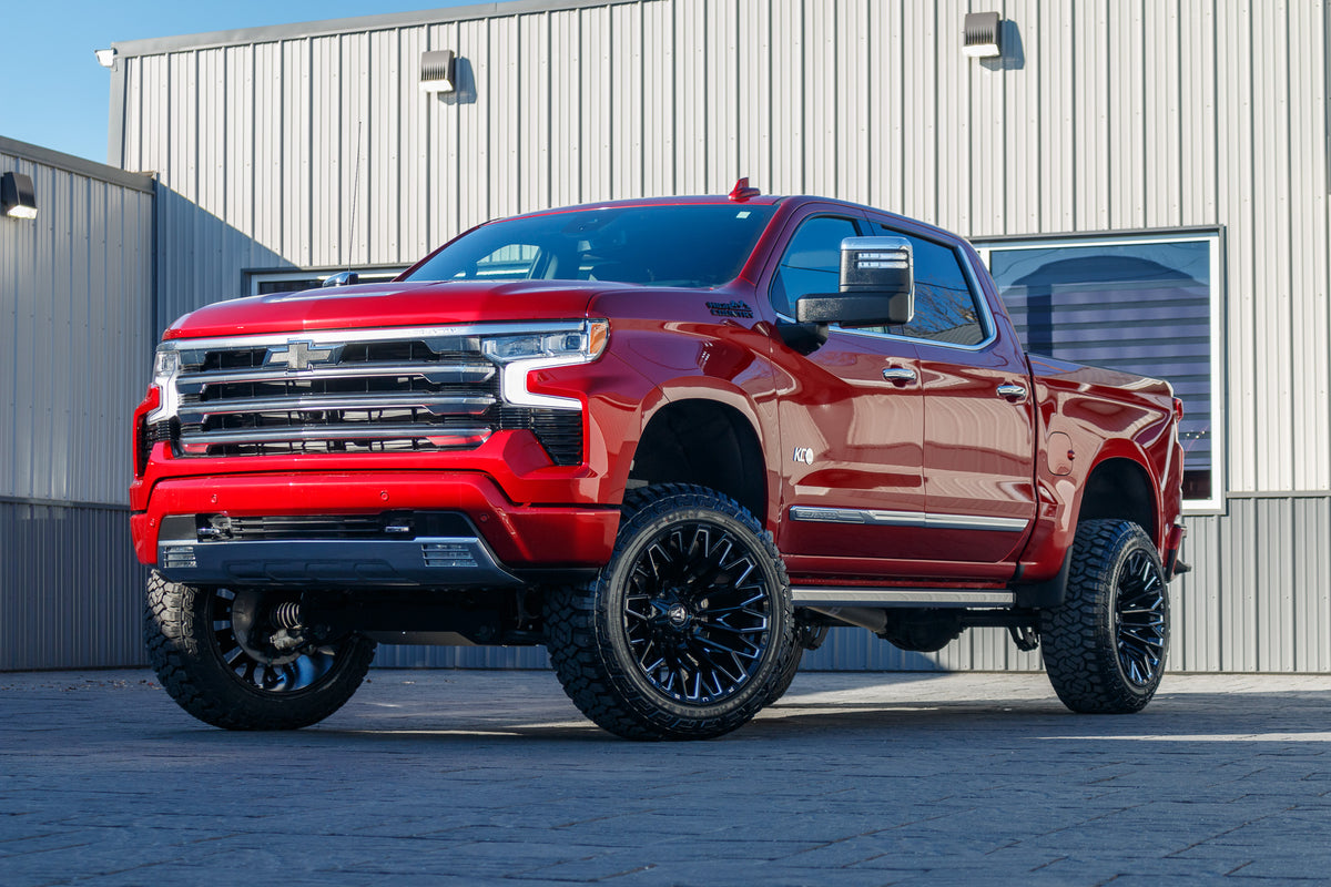 2024 Chevrolet Silverado 1500 High Country with a 6" Rough Country lift kit, 22x12 Fuel Strike wheels, and 35" Fury Country Hunter R/T tires.