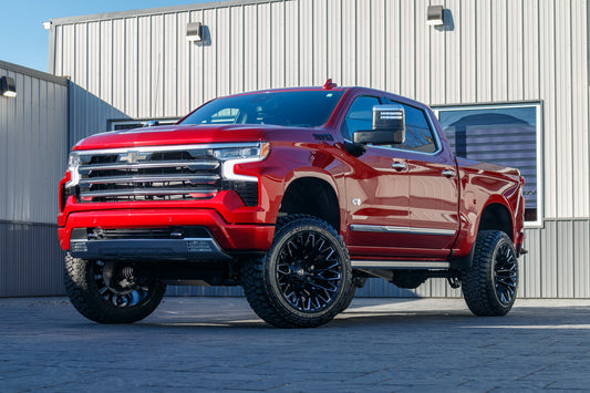 2024 Chevrolet Silverado 1500 High Country with a 6" Rough Country lift kit, 22x12 Fuel Strike wheels, and 35" Fury Country Hunter R/T tires.