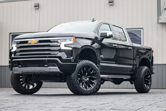 2024 Chevrolet Silverado 1500 High Country with a 6" Rough Country suspension kit, 22x12 Fuel Flame wheels, and 35" Fury Country Hunter R/T tires.