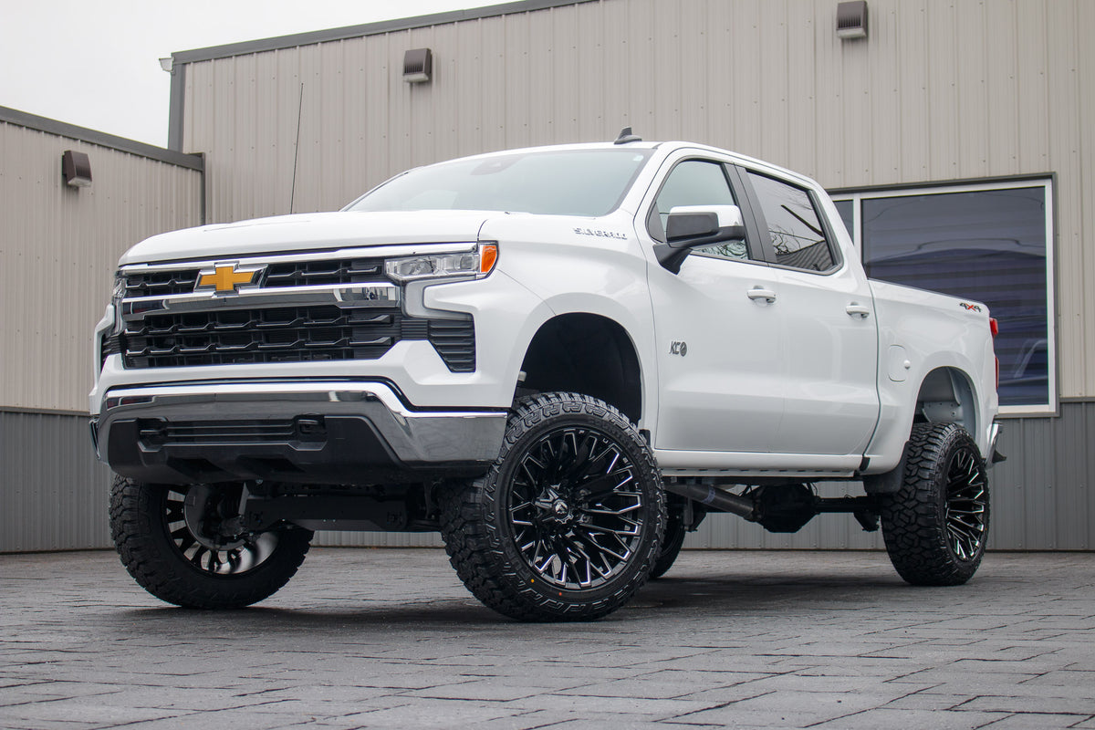 2025 Chevrolet Silverado 1500 LT with a 6" Rough Country lift kit, 22x12 Fuel Strike wheels, and 35" Fury Country Hunter R/T tires.
