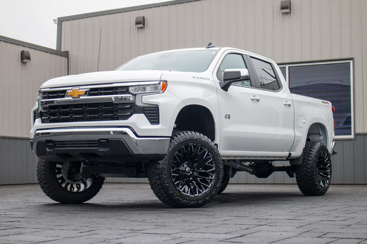 2025 Chevrolet Silverado 1500 LT with a 6" Rough Country lift kit, 22x12 Fuel Strike wheels, and 35" Fury Country Hunter R/T tires.