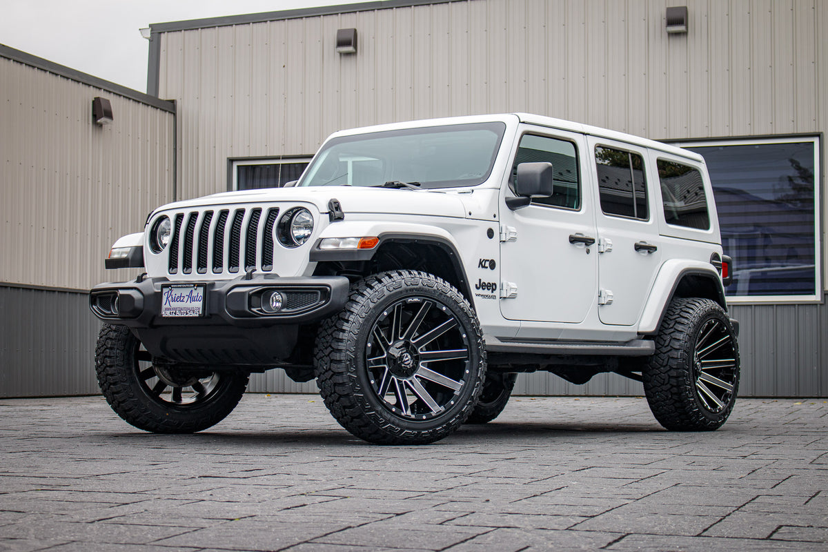2022 Jeep Wrangler Unlimited Sahara Altitude with a 2.5" Rough Country lift kit, 22x12 Fuel Contra wheels, and 35" Fury Country Hunter R/T tires.