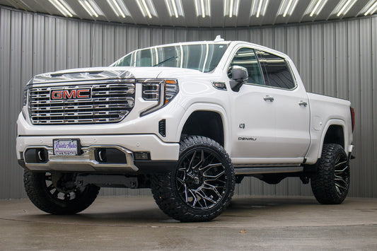 2023 GMC Sierra 1500 Denali with a 6" Rough Country suspension kit, 22x12 Fuel Twitch wheels, and 35" Fury Country Hunter R/T tires.