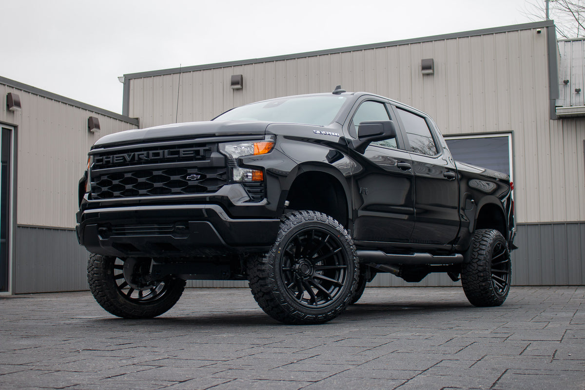 2025 Chevrolet Silverado 1500 Custom with a 6" Rough Country lift kit, 22x12 Fuel Burn wheels, and 35" Fury Country Hunter R/T tires.
