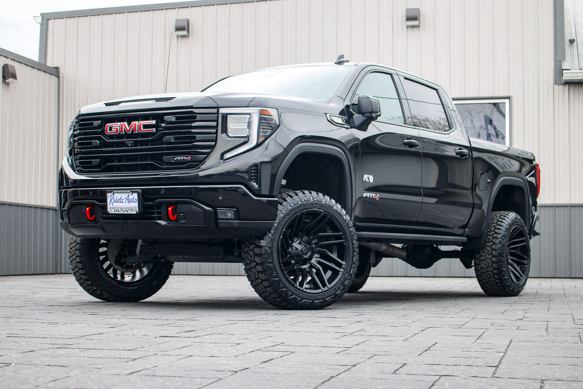 2023 GMC Sierra 1500 AT4 with a 6" Rough Country lift kit, 22x12 Fuel Typhoon wheels, and 35" Fury Country Hunter R/T tires.