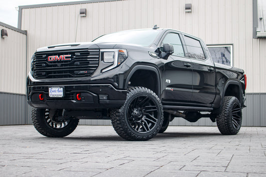 2023 GMC Sierra 1500 AT4 with a 6" Rough Country lift kit, 22x12 Fuel Typhoon wheels, and 35" Fury Country Hunter R/T tires.