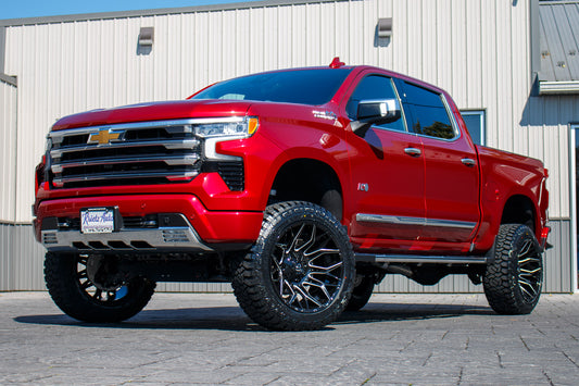 2023 Chevrolet Silverado 1500 High Country with a 6" Rough Country suspension kit, 22x12 Fuel Twitch wheels, and 35" Fury Country Hunter R/T tires.