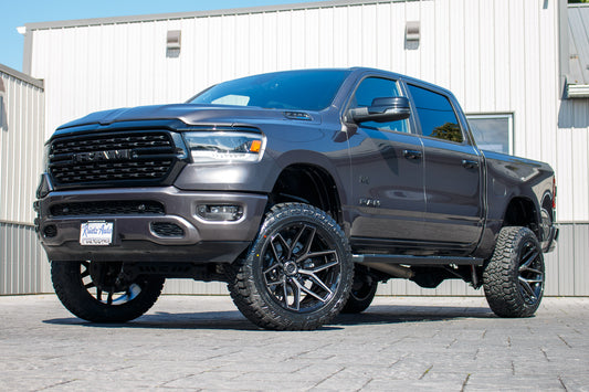 2023 Ram 1500 Big Horn with a 6" Rough Country lift kit, 22x12 Fuel Flux wheels, and 35" Fury Country Hunter R/T tires.