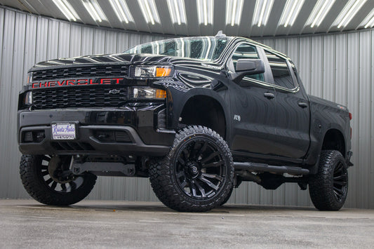 2021 Chevrolet Silverado 1500 Custom with a 6" Rough Country lift kit, 22x12 Fuel Blitz wheels, and 35" Fury Country Hunter R/T tires.