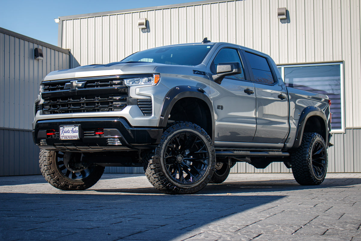 2025 Chevrolet Silverado 1500 LT Trail Boss with a 6" Rough Country lift kit, 22x12 Fuel Flame wheels, and 35" Fury Country Hunter R/T tires.