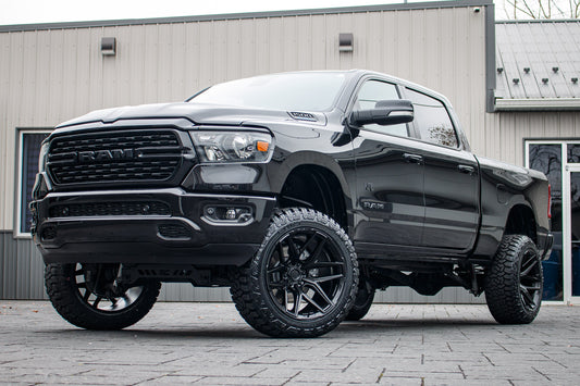 2022 Ram 1500 Big Horn with a 6" Rough Country lift kit, 22x12 Fuel Flux wheels, and 35" Fury Country Hunter R/T tires.