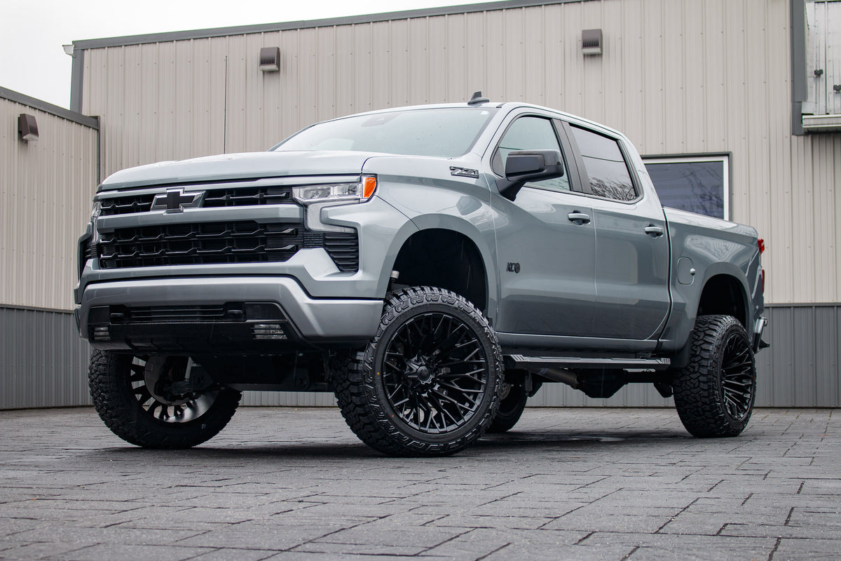 2024 Chevrolet Silverado 1500 RST with a 6" Rough Country lift kit, 22x12 Fuel Strike wheels, and 35" Fury Country Hunter R/T tires.