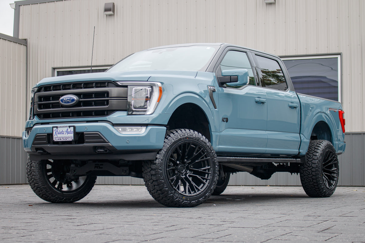 2023 Ford F-150 Lariat with a 6" Rough Country lift kit, 22x12 Fuel Rebar wheels, and 35" Fury Country Hunter R/T tires.