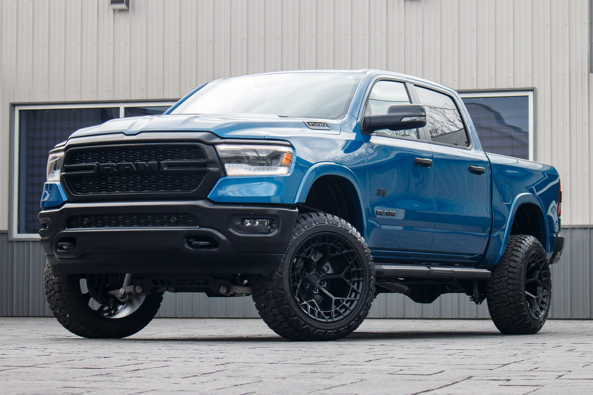 2024 Ram 1500 Big Horn with a 6" Rough Country lift kit, 22x12 Fuel Charger wheels, and 35" Fury Country Hunter R/T tires.