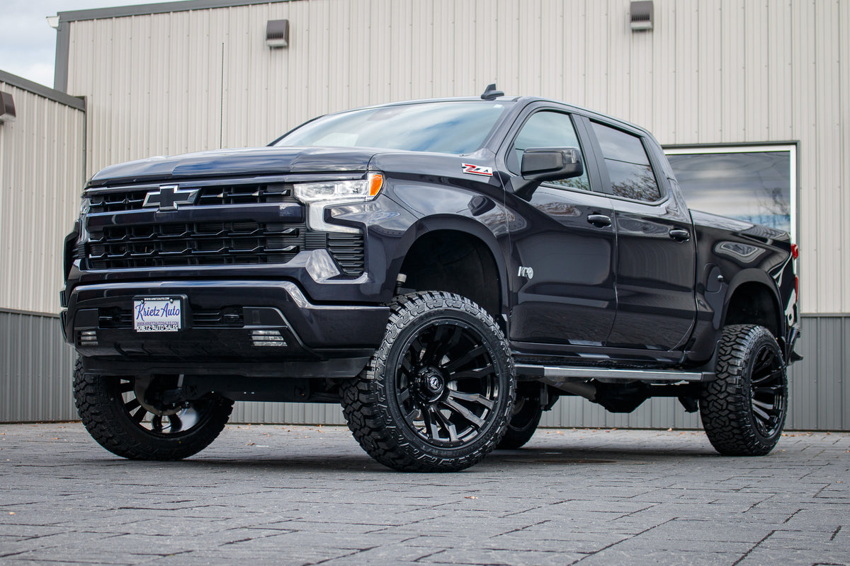 2024 GMC Sierra 1500 Denali with a 6" Rough Country lift kit, 22x12 Fuel Strike wheels, and 35" Fury Country Hunter R/T tires.