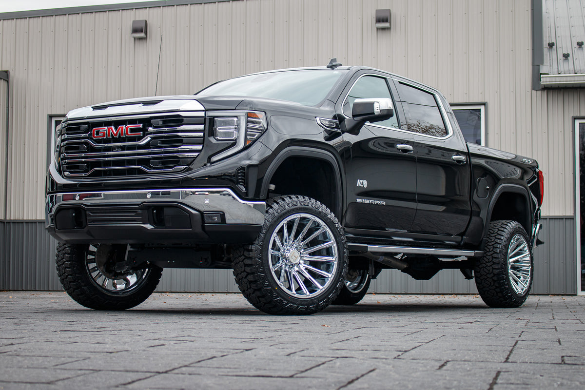 2024 GMC Sierra 1500 SLT with a 6" Rough Country lift kit, 22x12 Hostile Typhoon wheels, and 35" Fury Country Hunter R/T tires.