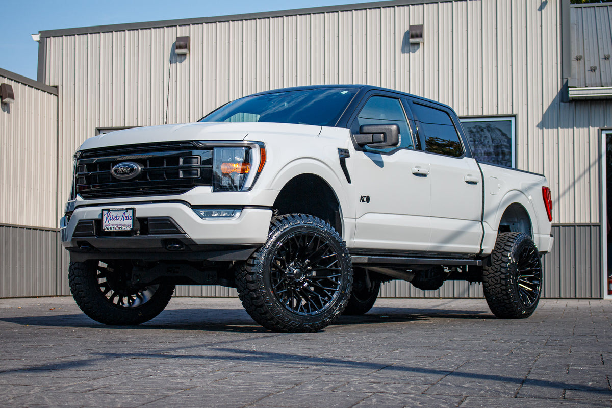 2023 Ford F-150 XLT with a 6" Rough Country lift kit, 22x12 Fuel Strike wheels, and 35" Fury Country Hunter R/T tires.