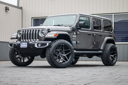 2021 Jeep Wrangler Unlimited Sahara 4XE with a 2.5" Rough Country lift kit, 22x12 Fuel Flux wheels, and 35" Fury Country Hunter R/T tires.