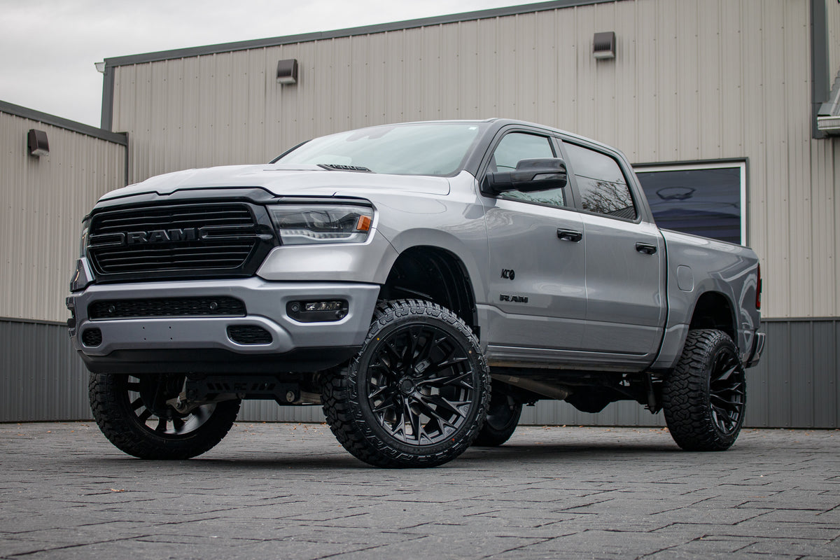 2024 Ram 1500 Laramie with a 6" Rough Country lift kit, 22x12 Fuel Flame wheels, and 35" Fury Country Hunter R/T tires.