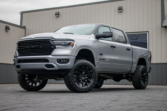 2024 Ram 1500 Laramie with a 6" Rough Country lift kit, 22x12 Fuel Flame wheels, and 35" Fury Country Hunter R/T tires.