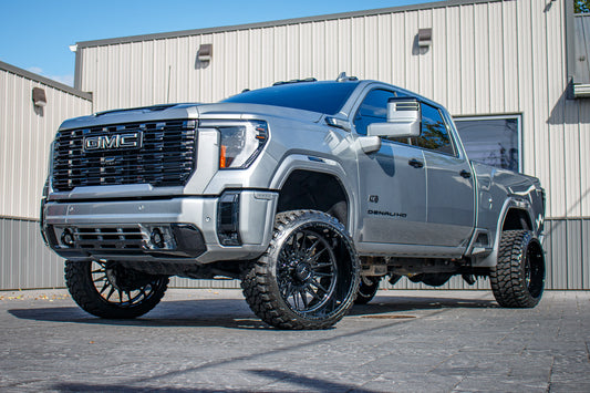 2024 GMC Sierra 2500 Denali with a 3" Cognito Leveling kit, 24x24 American Force Notch wheels, and 33" Fury Country Hunter M/T tires.