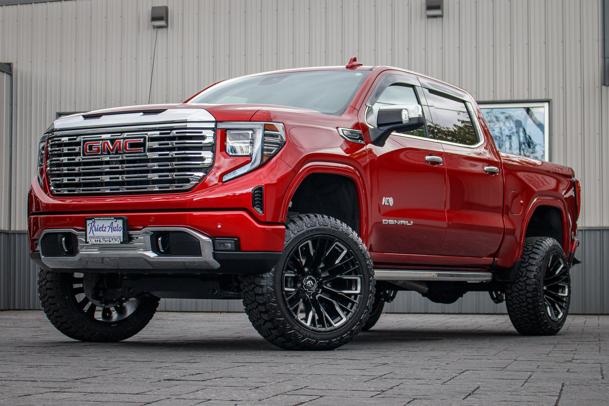 2023 GMC Sierra 1500 Denali with a 6" Rough Country lift kit, 22x12 Fuel Rebar wheels, 35" Fury Country Hunter R/T tires.