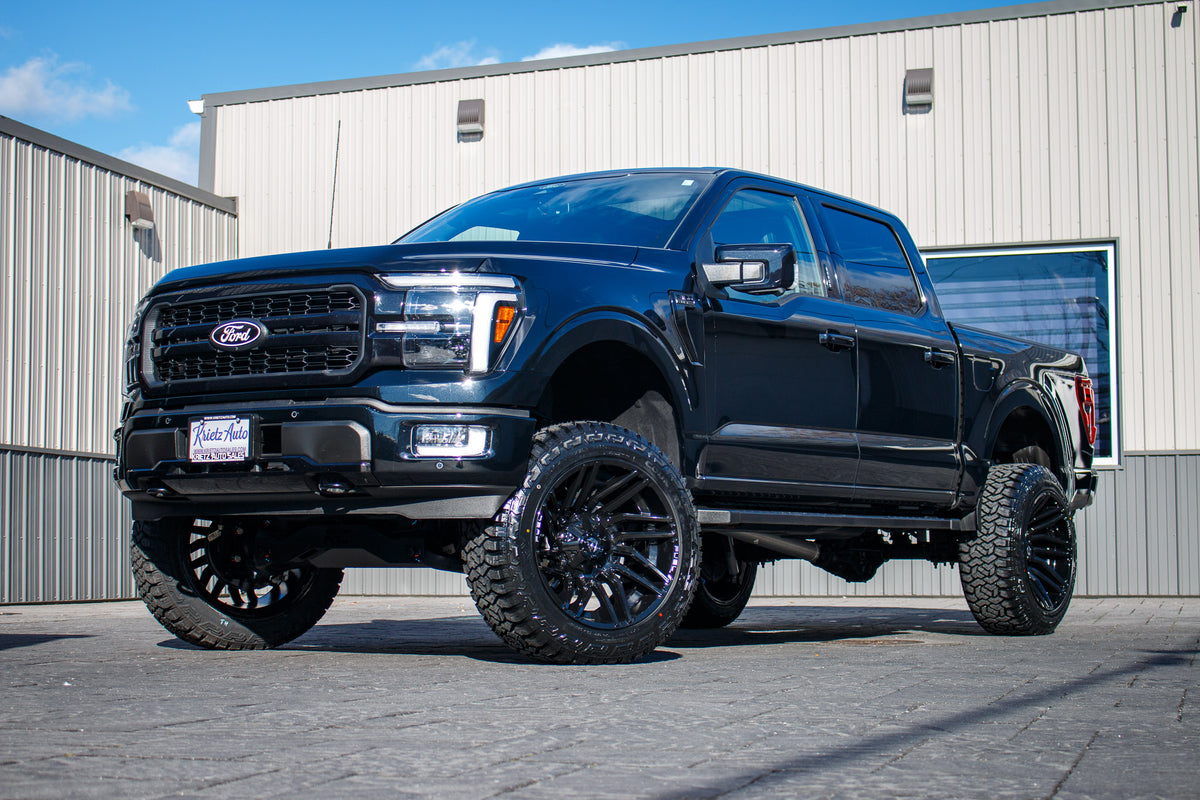 2024 Ford F-150 Lariat with a 6" Rough Country lift kit, 22x12 Fuel Typhoon wheels, and 35" Fury Country Hunter R/T tires.