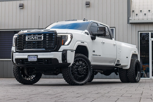 2025 GMC Sierra 3500 Denali Ultimate with a 4" CST lift kit, 26x8.25 American Force Plague wheels, and AMP Terrain Attack M/T A tires.