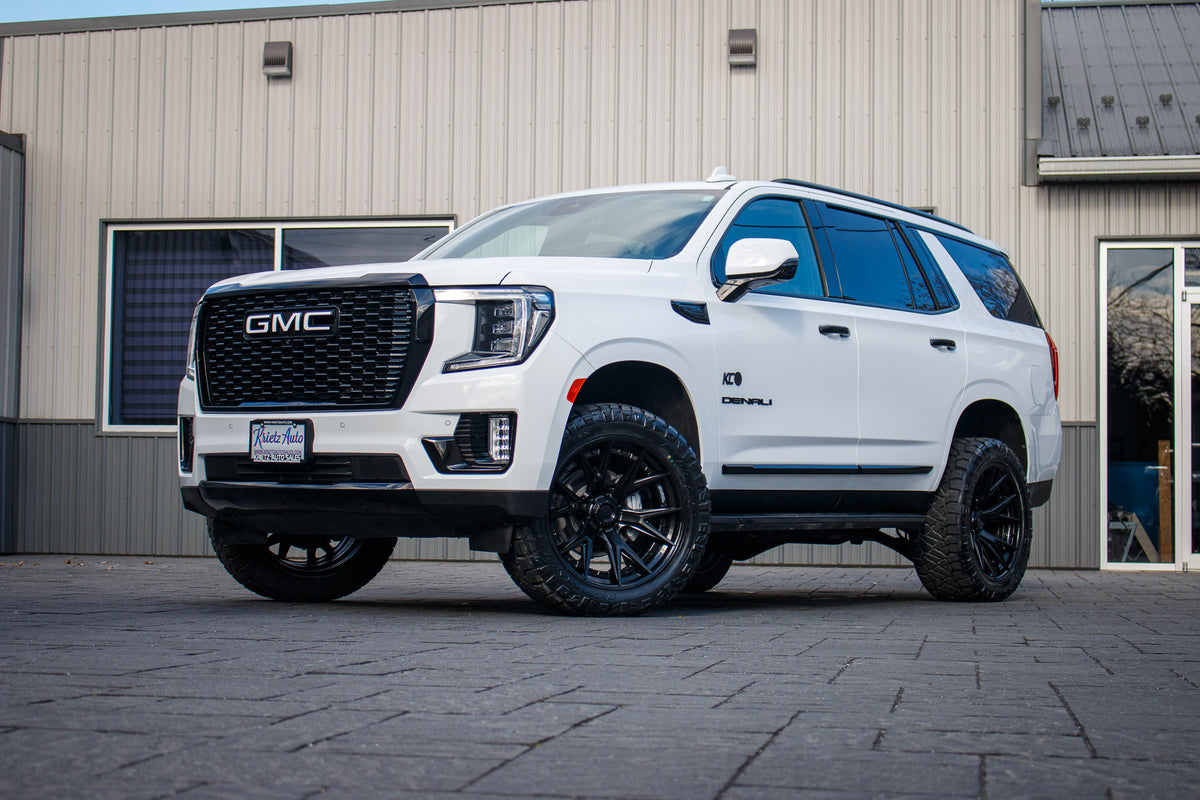 2023 GMC Yukon Denali with a 3" ReadyLift lift kit, 22x10 Fuel Catalyst wheels, and 295/50 Nitto Ridge Grappler tires.