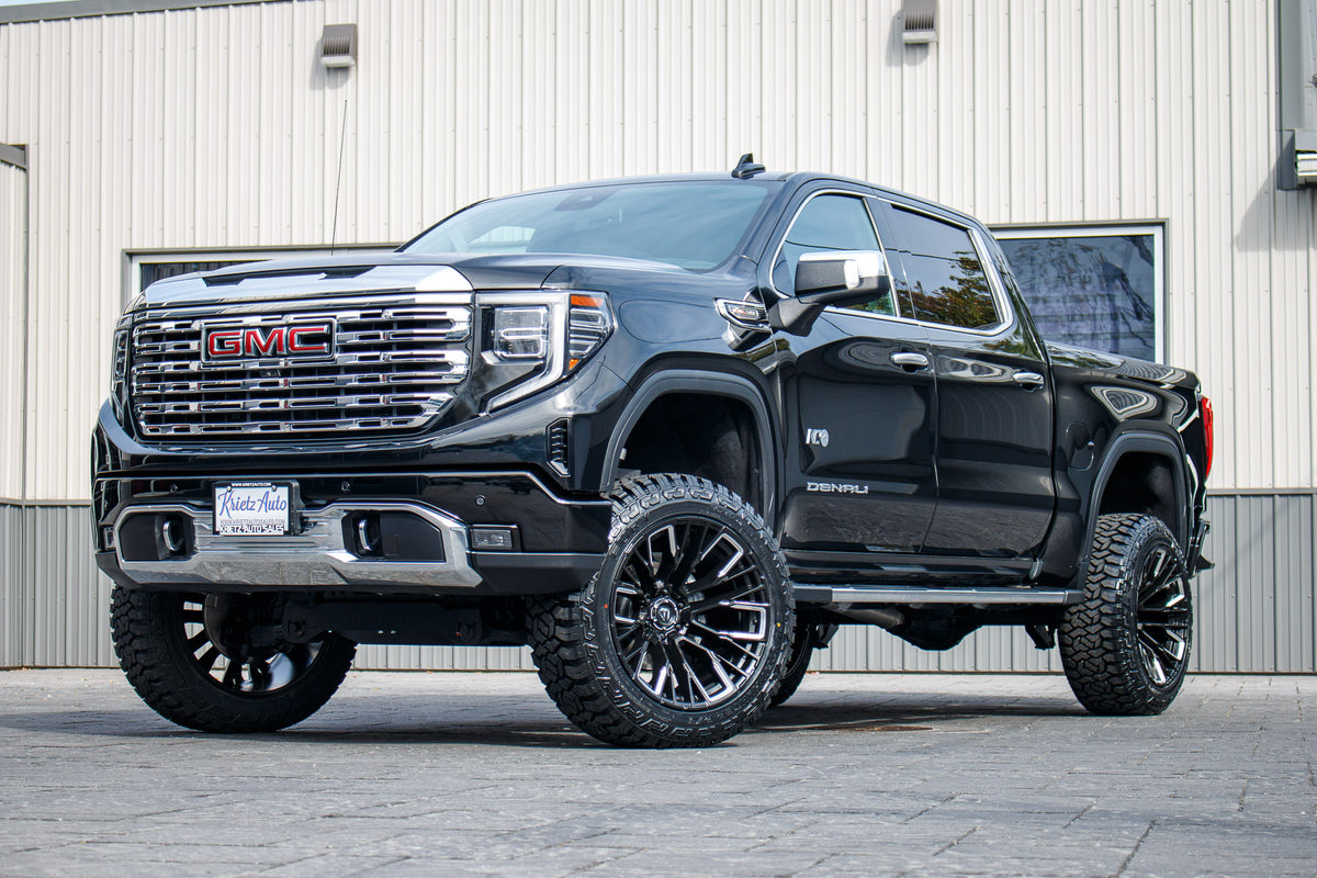 2022 GMC Sierra 1500 Denali with a 6" Rough Country suspension kit, 22x12 Fuel Rebar wheels, and 35" Fury Country Hunter R/T tires.