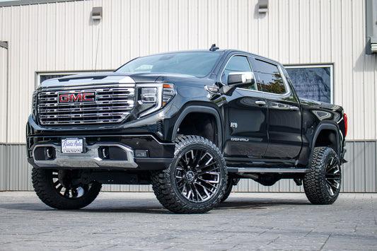 2022 GMC Sierra 1500 Denali with a 6" Rough Country suspension kit, 22x12 Fuel Rebar wheels, and 35" Fury Country Hunter R/T tires.
