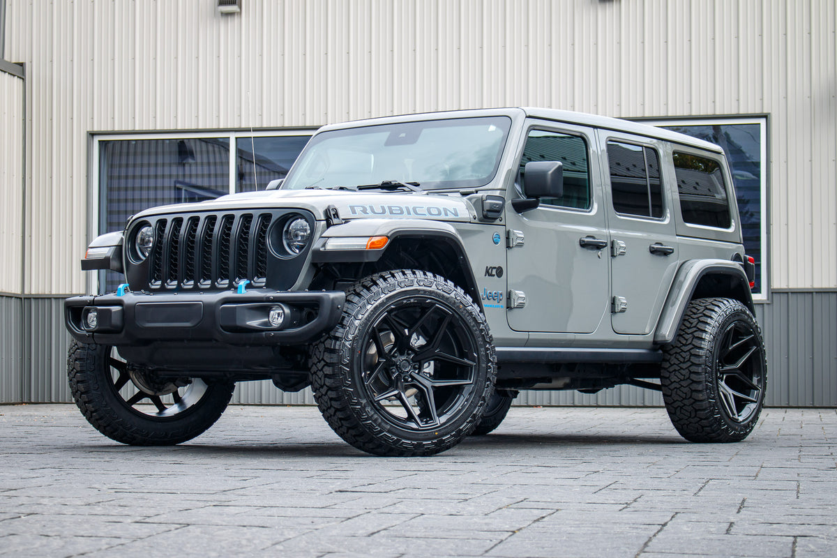 2023 Jeep Wrangler Unlimited Rubicon 4XE with Jeep Stock suspension, 22x12 Fuel Flux wheels, and 35" Fury Country Hunter R/T tires.