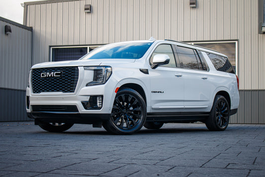 2023 GMC Yukon XL Denali Ultimate with GMC Factory suspension, 22x10 GMC Stock wheels, and Bridgestone Alenza tires.