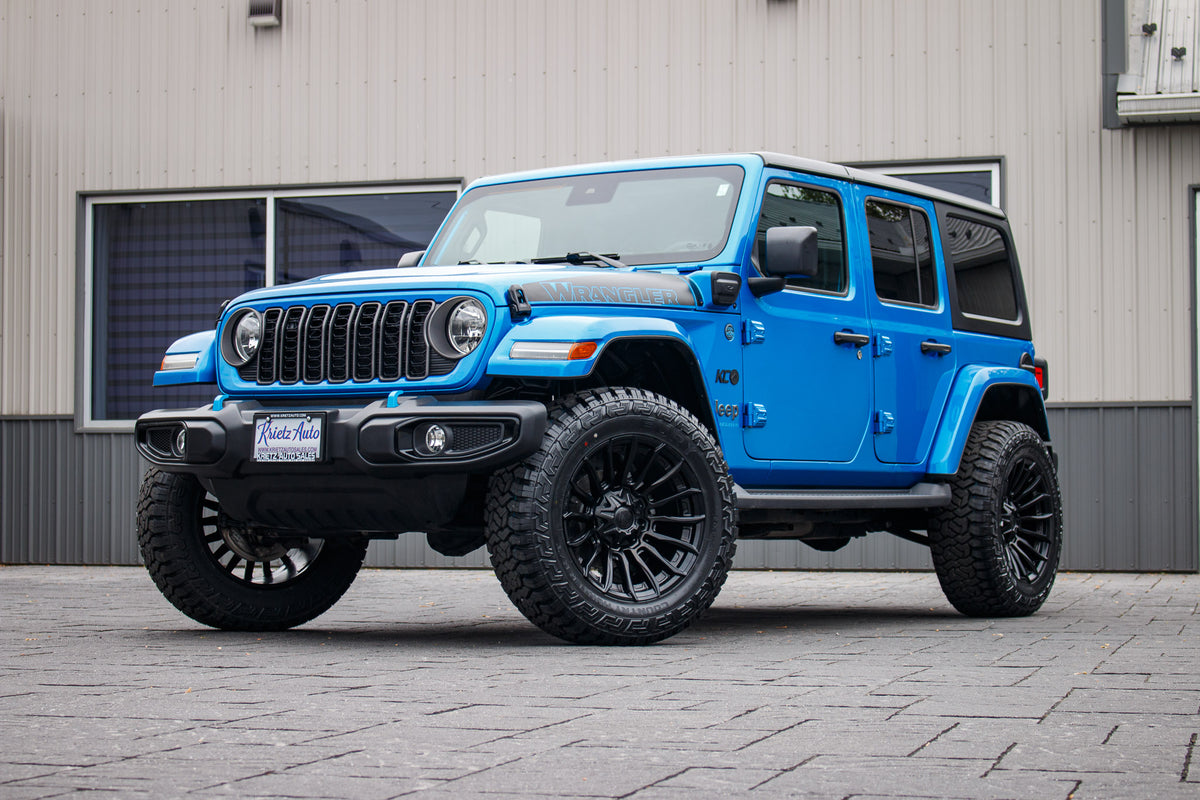 2024 Jeep Wrangler Sport S 4XE with a 2.5" Rough Country lift kit, 20x10 Fuel Blade wheels, and 35" Fury Country Hunter R/T tires.