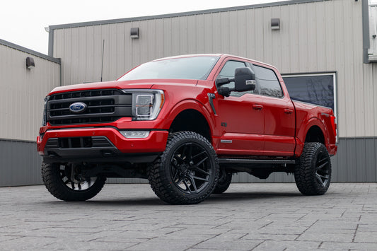 2023 Ford F-150 Lariat with a 6" Rough Country lift kit, 22x12 Fuel Flux wheels, and 35" Avix Trailtek R/T tires.
