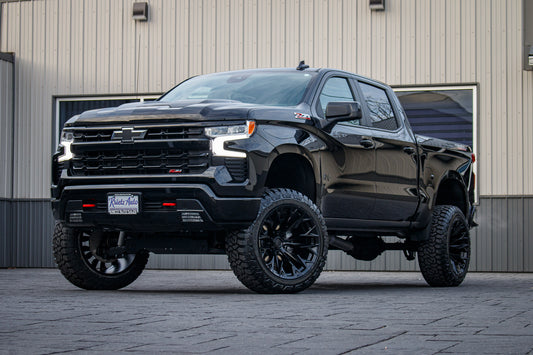 2023 Chevrolet Silverado 1500 LT Trail Boss with a 6" Rough Country lift kit, 22x12 Fuel Flame wheels, and 35" Fury Country Hunter R/T tires.
