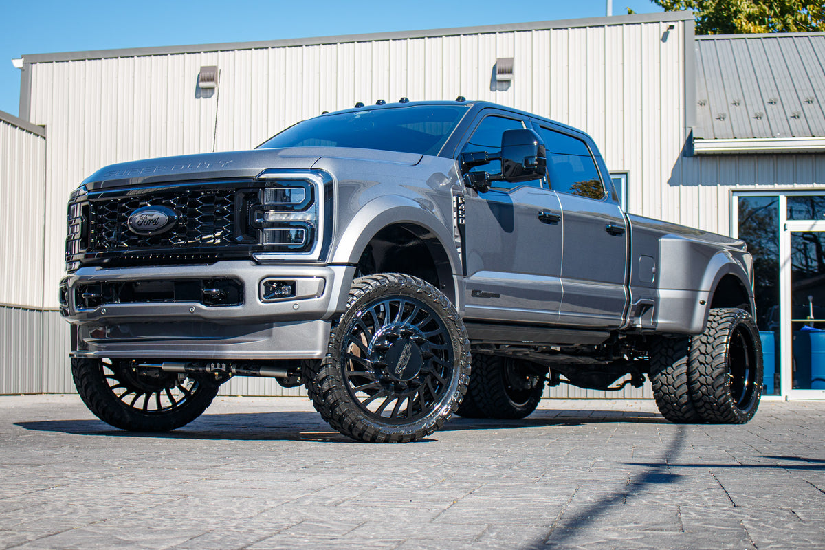 2024 Ford F-450 Super Duty Platinum with a 4" Wicked lift kit, 26x8.25 JTX Slayer wheels, and 37" AMP Terrain Attack M/T A tires.