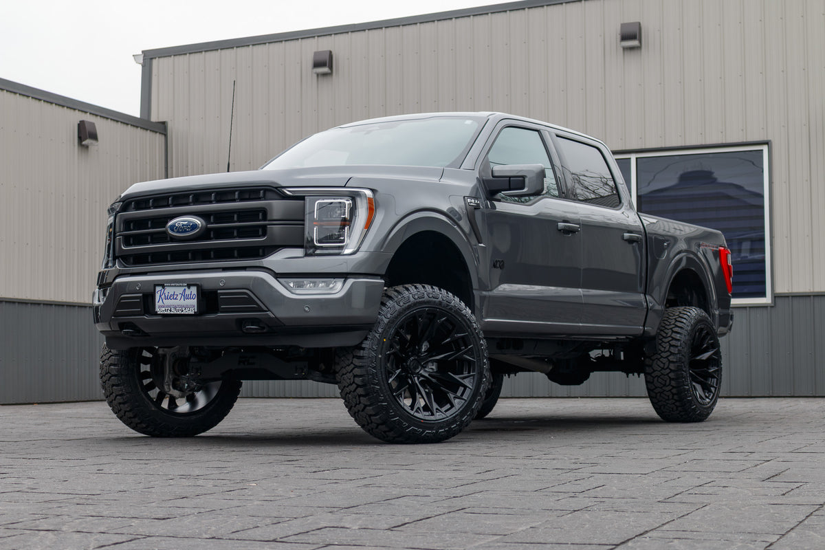 2023 Ford F-150 XL with a 6" Rough Country lift kit, 22x12 Fuel Flame wheels, and 35" Fury Country Hunter R/T tires.