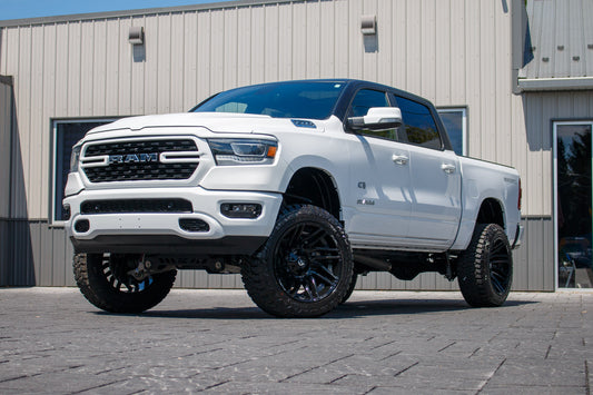 2022 Ram 1500 Lone Star with a 6" Rough Country lift kit, 22x12 Fuel Typhoon wheels, and Fury Country Hunter R/T tires.