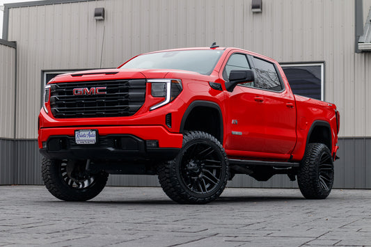 2023 GMC Sierra 1500 Elevation with a 6" Rough Country lift kit, 22x12 Fuel Typhoon wheels, and 35" Fury Country Hunter R/T tires.